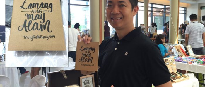 Manny Viloria holding notebook with calligraphy of Pat Diosana